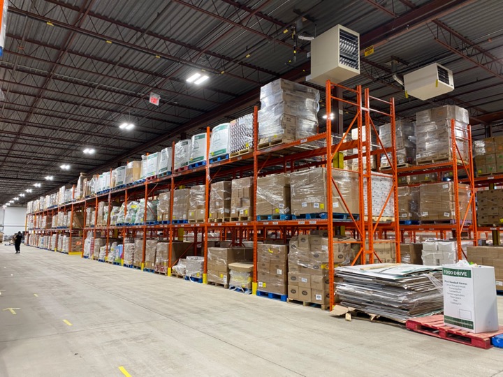 Interior photo of The Mississauga Food Bank's new facility at 4544 Eastgate Parkway, Mississauga. Photo shows the new warehouse with stocked shelves.